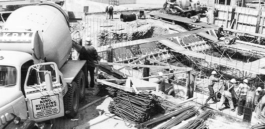 A black and white photo of construction workers.